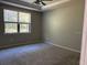 Bedroom featuring neutral carpet and natural light from a large window at 9143 Sw 70Th Loop, Ocala, FL 34481