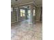 Open-concept dining room with tile floors, neutral colors, and ample natural light at 9143 Sw 70Th Loop, Ocala, FL 34481