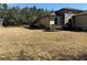 House exterior featuring a large grassy front yard and a stone accented front porch at 9143 Sw 70Th Loop, Ocala, FL 34481