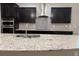 Granite countertop kitchen island with double sink and modern faucet at 9143 Sw 70Th Loop, Ocala, FL 34481