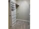 Well-organized walk-in closet with built-in shelving and drawers at 9143 Sw 70Th Loop, Ocala, FL 34481