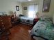 Bedroom with a natural light and hard wood floors at 9686 Sw 92Nd Place Rd, Ocala, FL 34481