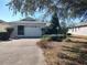 Front view of a single story house with a two-car garage at 9686 Sw 92Nd Place Rd, Ocala, FL 34481