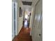 Hallway with a hardwood floor and multiple closets at 9686 Sw 92Nd Place Rd, Ocala, FL 34481