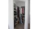 Walk-in closet with custom shelving and ample storage space at 10870 Sw 47Th Ct, Ocala, FL 34476