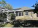 Exterior of house with a pool and enclosed patio plus solar panels at 10870 Sw 47Th Ct, Ocala, FL 34476