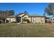 Charming one-story home featuring a well-manicured lawn and inviting landscaping at 10870 Sw 47Th Ct, Ocala, FL 34476