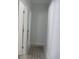 Hallway area of home features neutral decor, tile flooring and access to other rooms at 10870 Sw 47Th Ct, Ocala, FL 34476