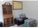 Cozy corner with antique desk, storage bench, and decorative trunks at 10870 Sw 47Th Ct, Ocala, FL 34476