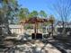 Outdoor space featuring a pergola with furniture, storage, and proximity to the pool and storage sheds at 10870 Sw 47Th Ct, Ocala, FL 34476