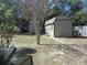 Two sheds in a private backyard with lush landscaping at 10870 Sw 47Th Ct, Ocala, FL 34476