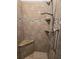 Updated shower with tile surround, seat, and grab bar at 10870 Sw 47Th Ct, Ocala, FL 34476