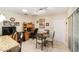 Cozy dining area with glass-top table and wooden chairs at 11159 Sw 68Th Ct, Ocala, FL 34476