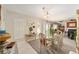 Elegant dining room with a glass-top table and chandelier at 11159 Sw 68Th Ct, Ocala, FL 34476