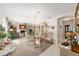 Bright dining room with glass-top table and view of living room at 11159 Sw 68Th Ct, Ocala, FL 34476