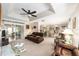 Relaxing living room with leather sofas and ceiling fan at 11159 Sw 68Th Ct, Ocala, FL 34476