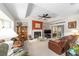 Cozy living room with leather sofas, fireplace and lots of light at 11159 Sw 68Th Ct, Ocala, FL 34476