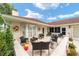 Inviting patio with wicker furniture, perfect for relaxing at 11159 Sw 68Th Ct, Ocala, FL 34476