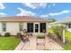 Cozy patio with wrought iron furniture and green space at 11159 Sw 68Th Ct, Ocala, FL 34476