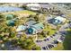 Aerial view of community amenities including tennis courts, pool, and clubhouse at 11545 Se 175Th St, Summerfield, FL 34491