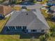 Aerial view of a single-story house with a gray roof at 11545 Se 175Th St, Summerfield, FL 34491