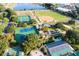 Aerial view of community with sports fields, pool and clubhouse at 11545 Se 175Th St, Summerfield, FL 34491