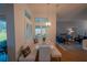 Breakfast nook features a white table and bench with a view to the living room at 11545 Se 175Th St, Summerfield, FL 34491