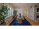 Elegant dining room with glass table, modern chandelier, and blue rug at 11545 Se 175Th St, Summerfield, FL 34491