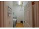 Laundry room with washer, dryer, and ample shelving at 11545 Se 175Th St, Summerfield, FL 34491