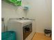 Bright laundry room with washer, dryer and shelving at 11545 Se 175Th St, Summerfield, FL 34491