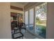 Cozy sunroom with wicker furniture and glass doors at 11545 Se 175Th St, Summerfield, FL 34491