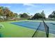 Two well-maintained tennis courts with seating at 11545 Se 175Th St, Summerfield, FL 34491