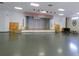 Large community hall with stage and seating at 1314 Noble Ct, Leesburg, FL 34788