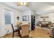 Bright dining area with table and chairs, adjacent to living room at 1314 Noble Ct, Leesburg, FL 34788