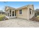 House exterior showcasing sunroom and patio area at 1314 Noble Ct, Leesburg, FL 34788