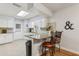 Kitchen features granite countertops and white cabinets at 1314 Noble Ct, Leesburg, FL 34788