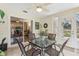 Sunroom with table and chairs, offering view of backyard at 1314 Noble Ct, Leesburg, FL 34788