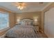 Comfortable bedroom with a queen-sized bed and tasteful decor at 13579 Se 89Th Terrace Rd, Summerfield, FL 34491