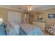 Bright bedroom with double doors and comfy bedding at 13579 Se 89Th Terrace Rd, Summerfield, FL 34491