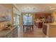 Dining room with wood table and chairs near kitchen at 13579 Se 89Th Terrace Rd, Summerfield, FL 34491