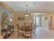 Casual dining area with a round table and chairs, adjacent to kitchen at 13579 Se 89Th Terrace Rd, Summerfield, FL 34491