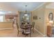 Casual dining area with a round table and chairs, adjacent to kitchen at 13579 Se 89Th Terrace Rd, Summerfield, FL 34491