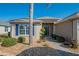 Welcoming front entry with blue shutters and well-maintained landscaping at 13579 Se 89Th Terrace Rd, Summerfield, FL 34491