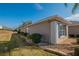 Side view of the house with well-maintained landscaping at 13579 Se 89Th Terrace Rd, Summerfield, FL 34491