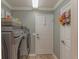 Bright laundry room with Samsung washer and dryer at 13579 Se 89Th Terrace Rd, Summerfield, FL 34491