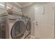 Laundry room with washer, dryer, and extra storage at 13579 Se 89Th Terrace Rd, Summerfield, FL 34491