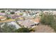 Aerial view showcasing a house and surrounding neighborhood at 1397 Oak Forest Dr, The Villages, FL 32162