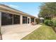 Back patio with bench, providing relaxing outdoor space at 1397 Oak Forest Dr, The Villages, FL 32162