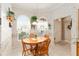 Cozy breakfast nook with a round table and chairs, bathed in natural light at 1397 Oak Forest Dr, The Villages, FL 32162