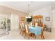 Formal dining room with elegant light fixture and hutch at 1397 Oak Forest Dr, The Villages, FL 32162